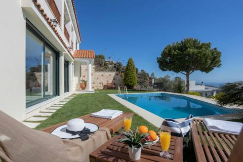 Sunbathe poolside and plan your itinerary underneath blue skies