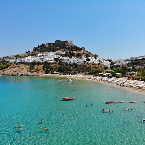 Visit the iconic clifftop acropolis at Lindos, just a short drive south