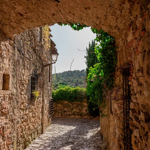 Immerse yourself in the charm of Girona while walking to the Platja de Sa Riera