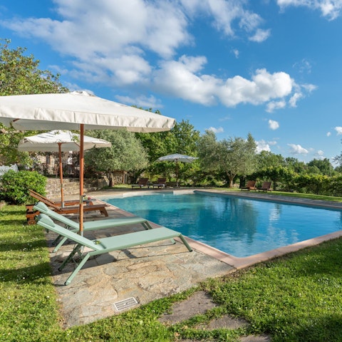 Unwind with a drink by the pool
