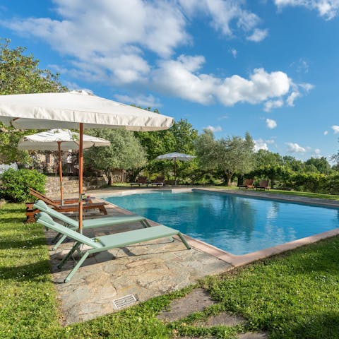 Unwind with a drink by the pool