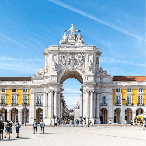 Visit bustling Praça do Comércio, a ten-minute walk away