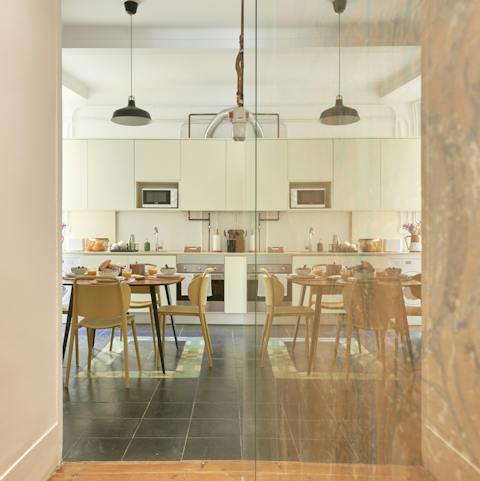 Start mornings with fresh coffee and pastéis de nata in the sleek kitchen