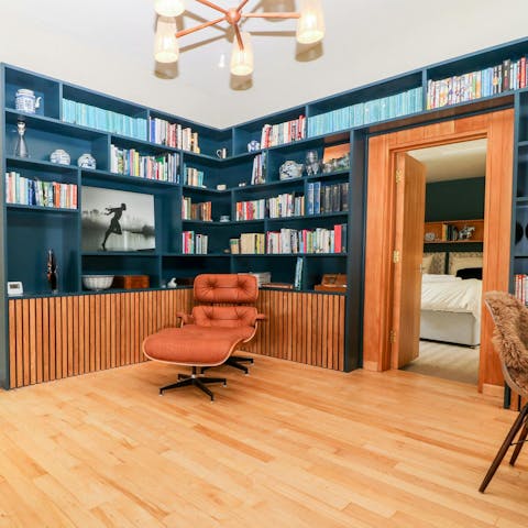 Choose a book and relax after a stroll in this home's private woodland