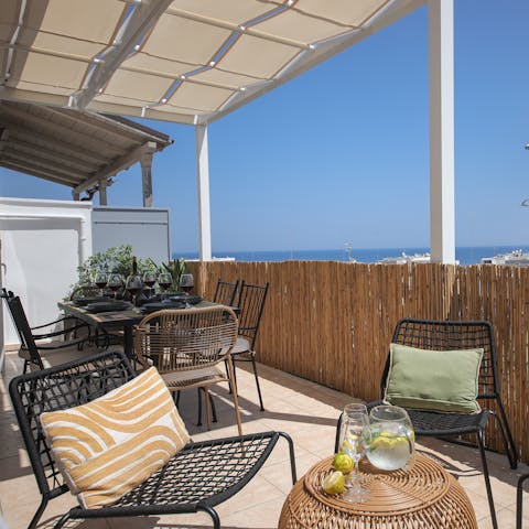 Relax on the terrace with sweeping views across the harbour