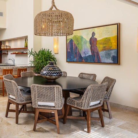 Gather around the sleek dining table for leisurely breakfasts prepared by your chef