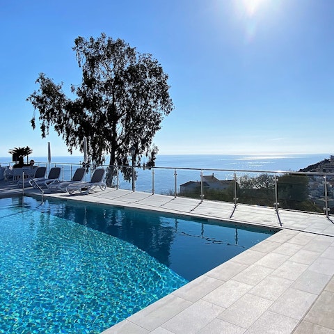 Enjoy the beautiful views across the sea from the swimming pool
