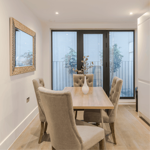 Open the glass doors and enjoy a moment on the apartment's balcony