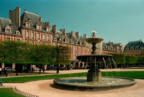 Admire Place des Vosges, Paris's oldest and most elegant royal square, a ten-minute walk