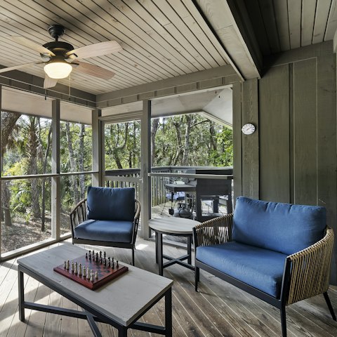Relax on the screened porch, overlooking the coastal forest and lagoon