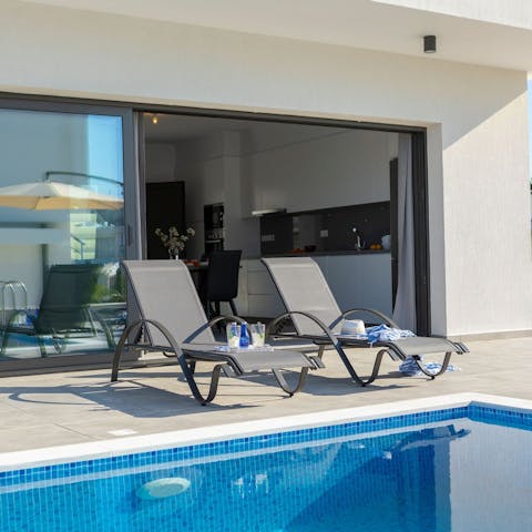 Enjoy a refreshing dip in the pool or relax poolside in the sun