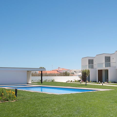 Go for a swim in the shared pool just beyond your front door