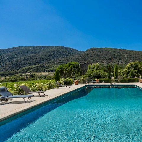Lounge by the pool with a glass of local rosé