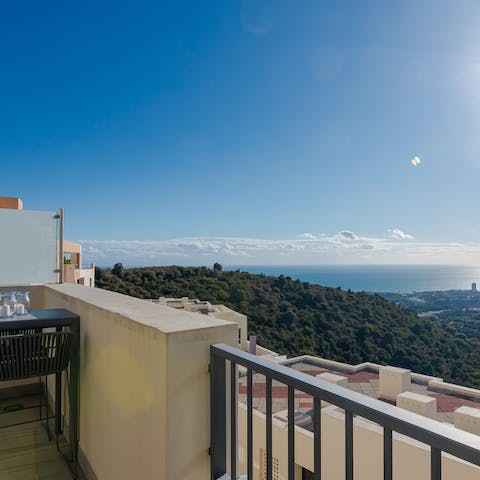Enjoy the view of verdant hills and sparkling sea from the terrace