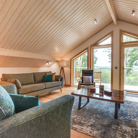 Get cosy on the sofa and gaze out at the woodland views