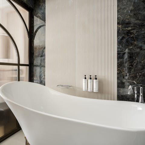 Relax in the claw-footed tub after a busy day in the City of Light