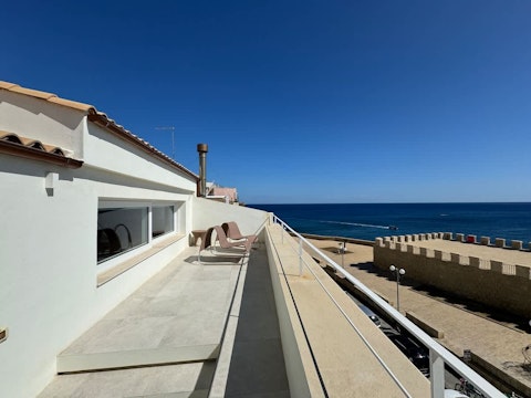 Stretch out above the Sicilian coast on a sun-soaked terrace