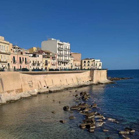 Swim in clear Sicilian waters steps from the old town