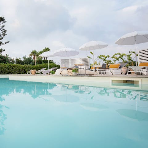 Chill out by the pool with a beverage in hand
