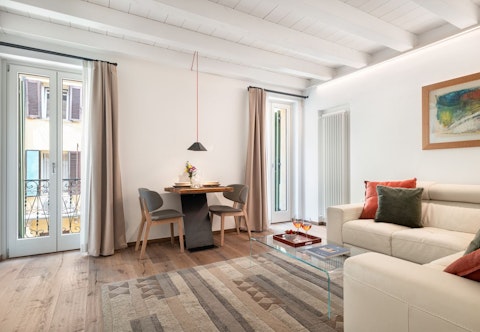 Settle into a bright living space with balcony access