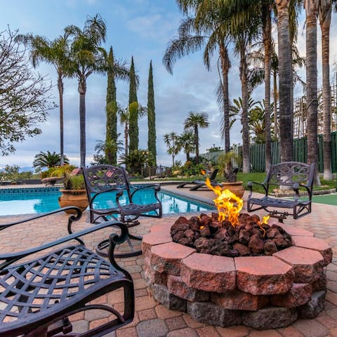 Watch the sun go down as you gather round the fire pit