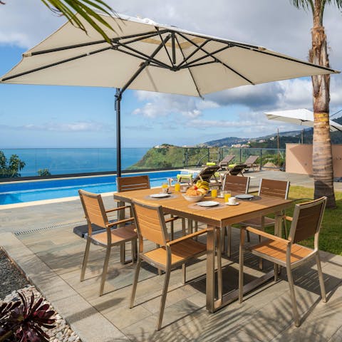 Take a pitcher of cocktails out to the dining set and toast to your getaway