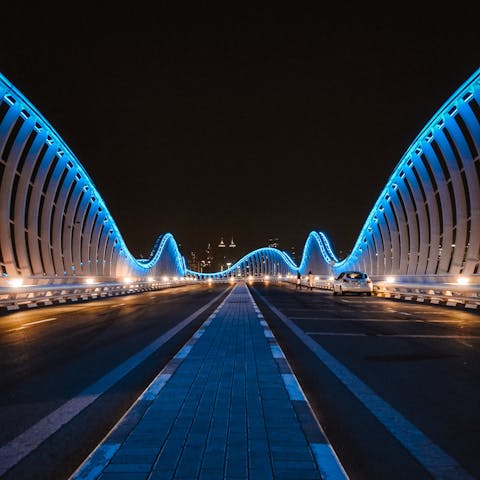 Admire the Meydan Bridge lights, you're a ten-minute drive away