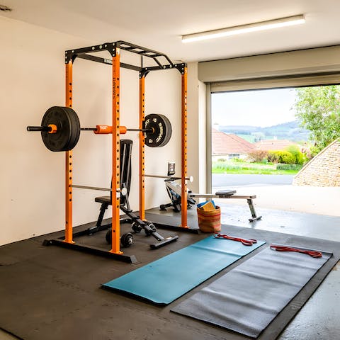 Keep up your fitness routine with the gym equipment in the garage