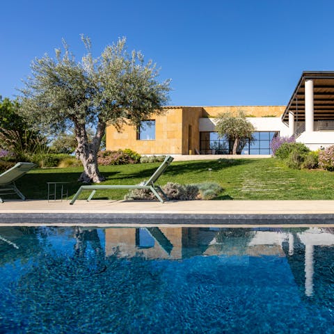 Slip into the infinity pool to admire the views