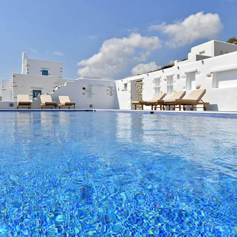 While away sunny afternoons in the infinity pool, cooling off in the crystal clear water