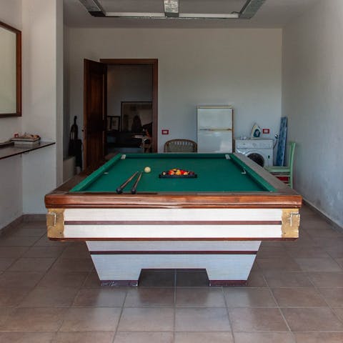 Challenge friends or family to a game of snooker