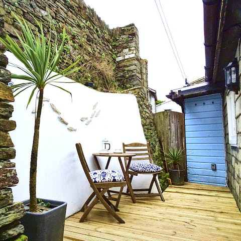 Enjoy your morning coffee on the decking of the private patio
