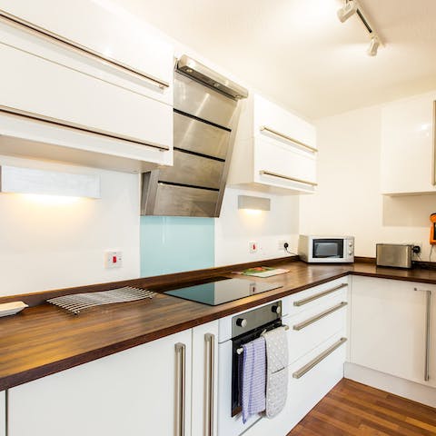 Rustle up a delicious home-cooked meal in the sleek kitchen