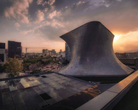 Marvel at Museo Soumaya's striking silver facade and vast art collection, a nineteen-minute walk