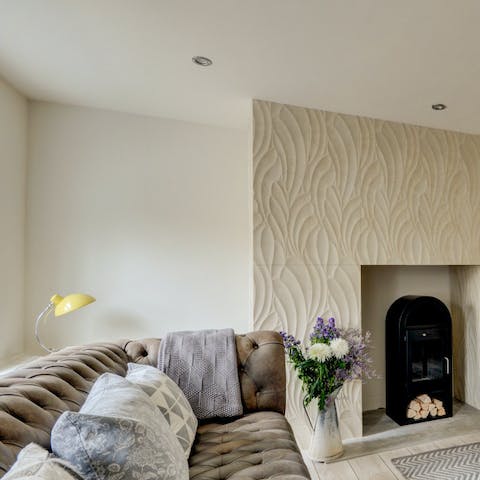 Cosy up on the sofa with a cup of tea and keep warm by the fire