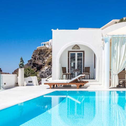 Sunbathe by the pool and enjoy the incredible views