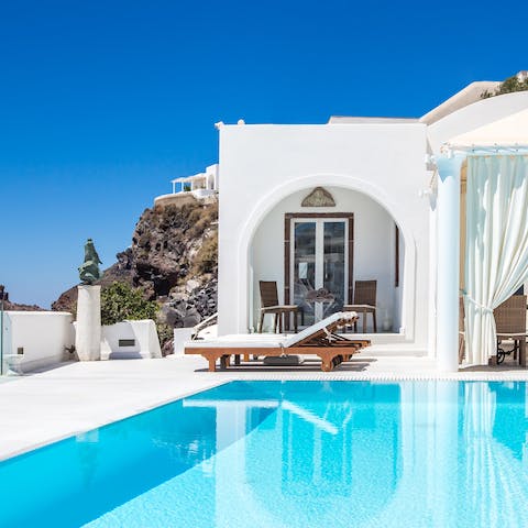 Sunbathe by the pool and enjoy the incredible views