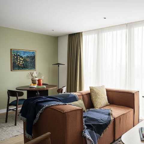 Lounge about on the mod sofa in the living area