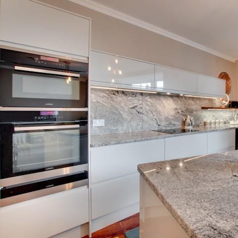 Cook delicious meals in the gleaming modern kitchen