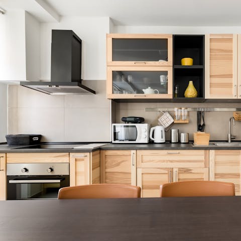 Prepare brioche and coffee in the sleek kitchen to start your day