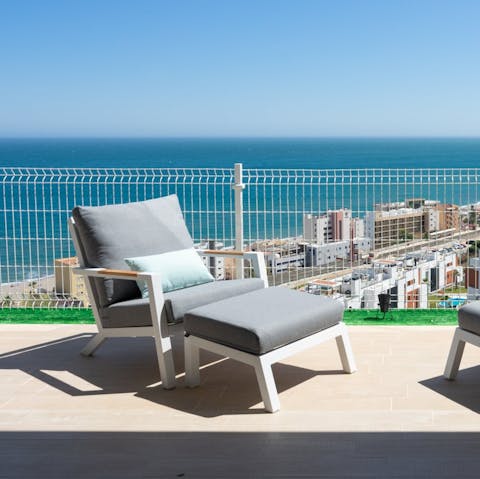 Laze in the sun while soaking up views of the Mediterranean from the terrace