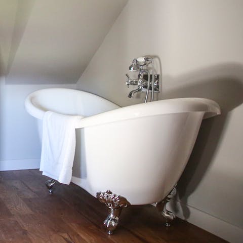 Relax in the deep clawfoot bathtub
