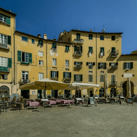 Soak up the atmosphere from nearby Piazza dell'Anfiteatro