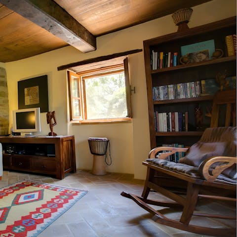 Curl up with a book from the home's library in the reading corner