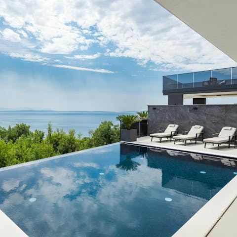 Savour the scenery from your spot by the pool