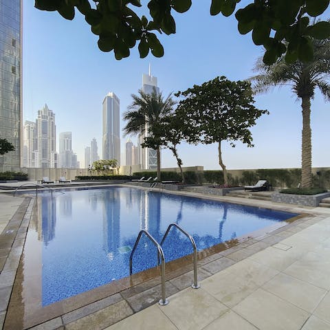 Enjoy a cooling dip in the palm-fringed pool