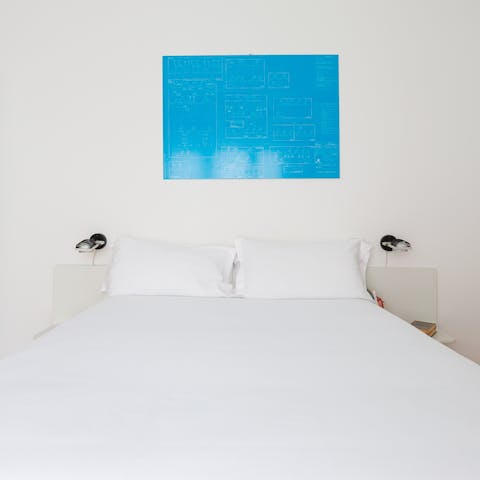 Sprawl out on the comfortable bed after a busy day