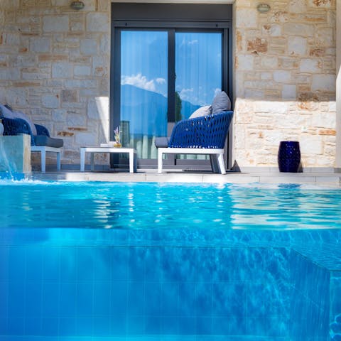 Cool off with a dip in your private pool with waterfall features