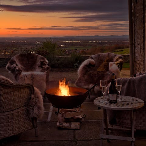 Gather around the fire pit on clear evenings – there are reindeer skin rugs to keep you warm well into the night