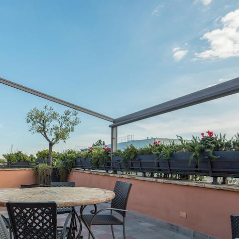 Watch the sun rise over the city skyline from the terrace